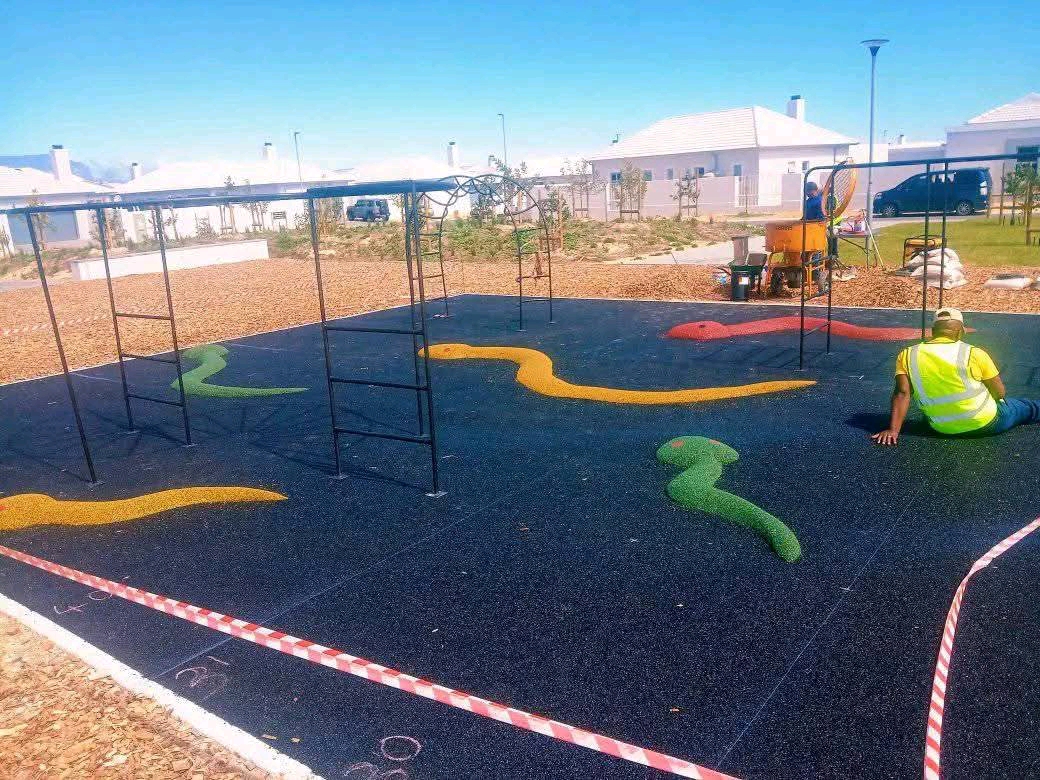 Rubber safety flooring installed under jungle gym